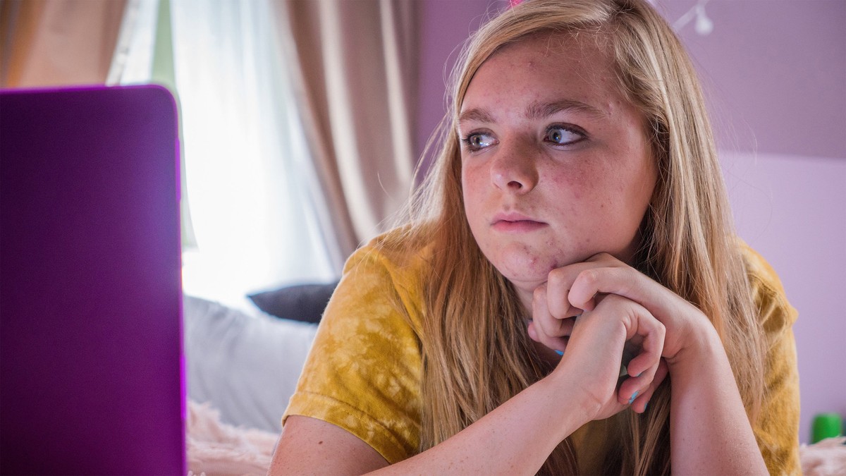 girl looking at laptop