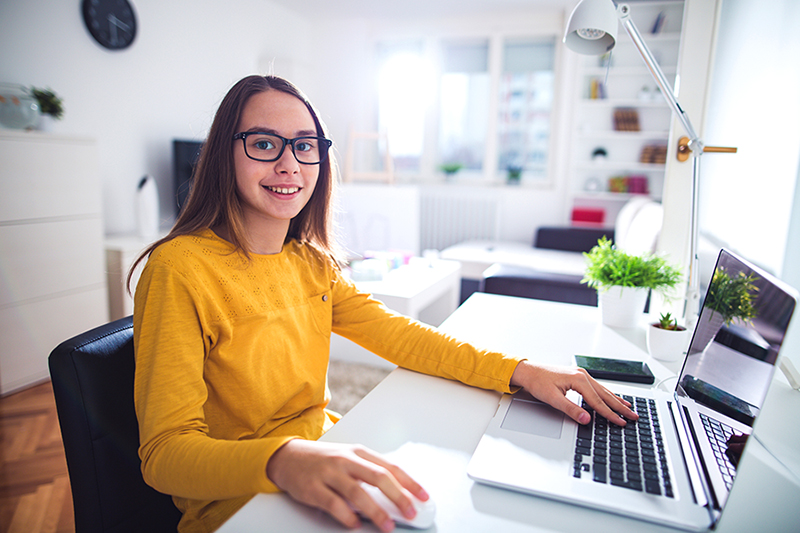teenage girl on laptop