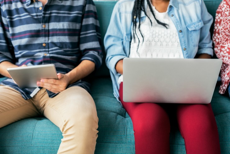 Cropped man and woman using electronic device free image