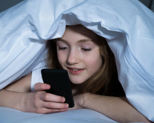 Child under blanket