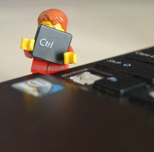 lego man taking key off keyboard