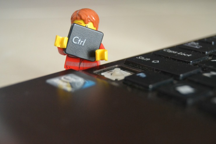 lego man taking key off keyboard