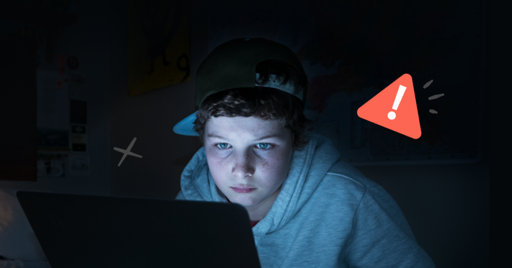 Illegal streaming sites header image of boy in front of computer in dark room