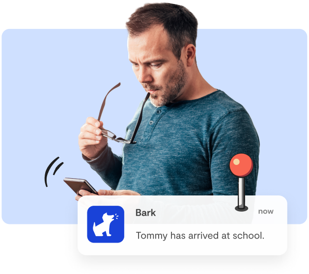 father reviewing Bark location alert - parental monitoring app