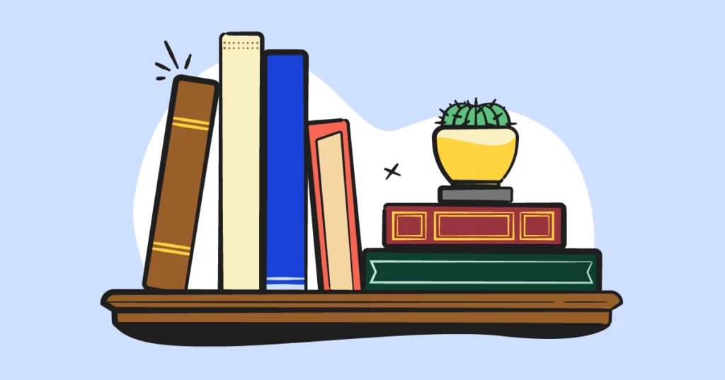 illustrated books and house plant on a shelf 