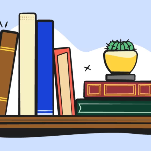 illustrated books and house plant on a shelf