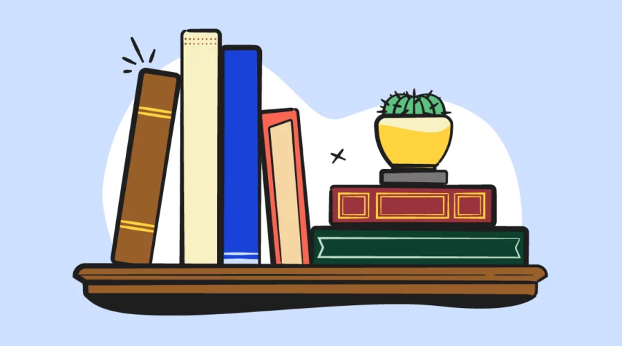 illustrated books and house plant on a shelf