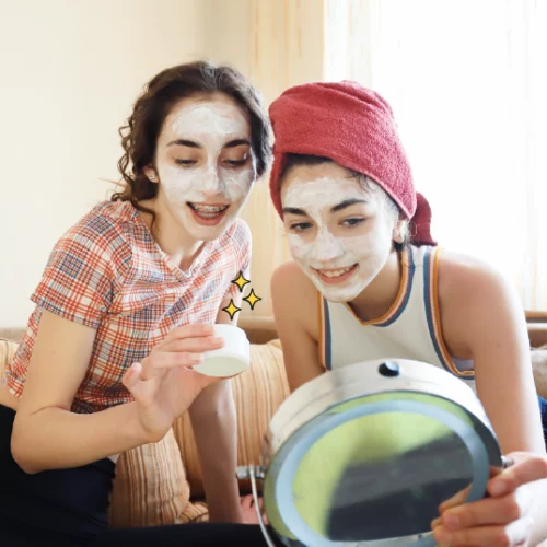 two teen girls doing face masks