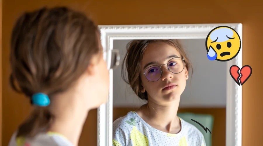 teen girl looking in the mirror, sad face and broken heart emoji