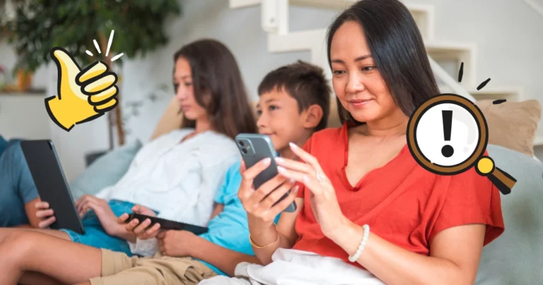 mom on her phone, next to two children