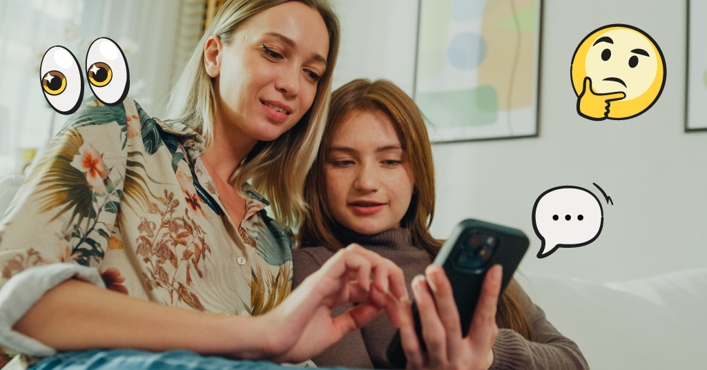 Mom and daughter looking at a phone together with emojis around them