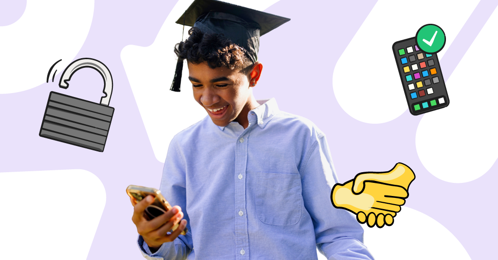 a teenager wearing a graduation cap and looking his phone