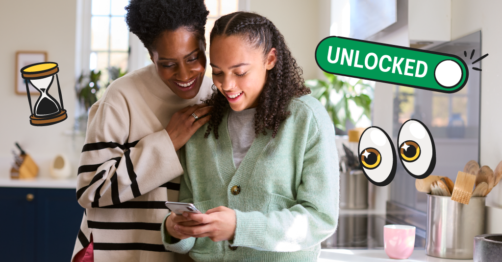 mother and daughter looking at phone