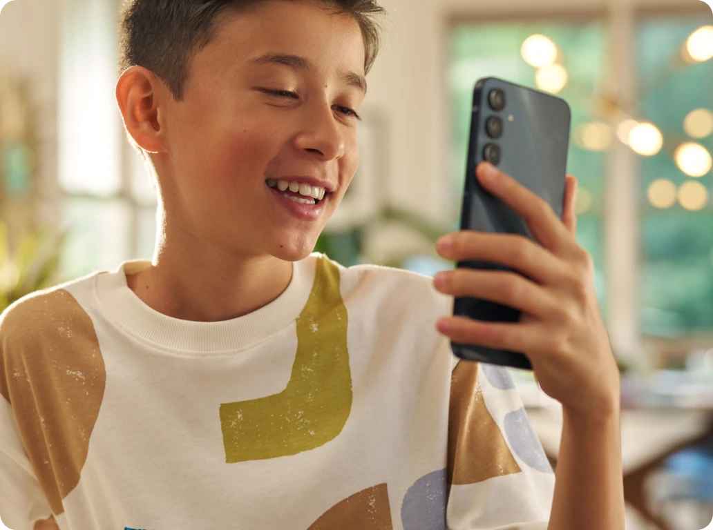 A boy using the Bark Phone