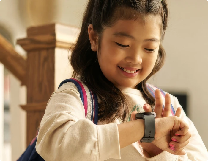 A girl wearing the Bark Watch