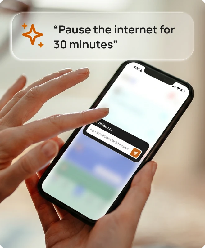A parent using the Bark Assistant to pause the internet