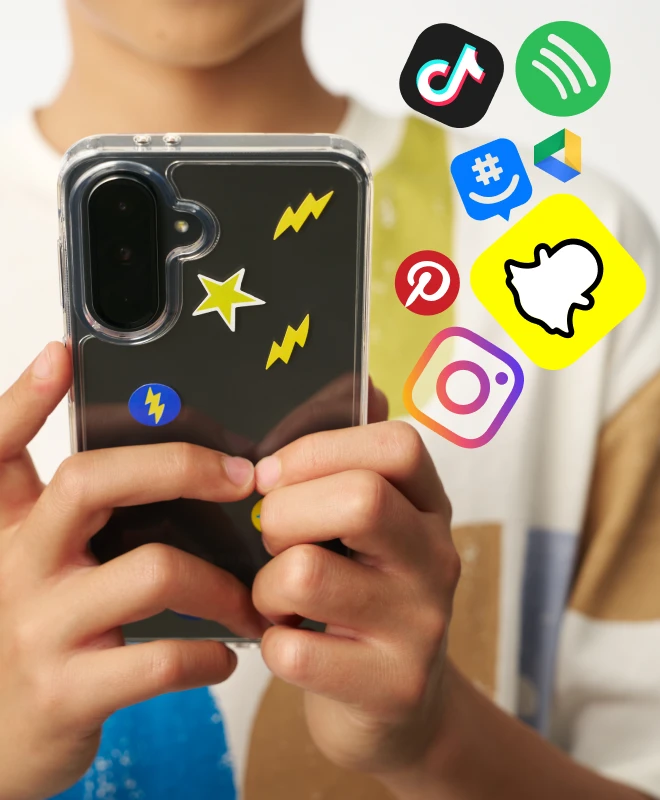 A boy using a phone surrounded by app icons