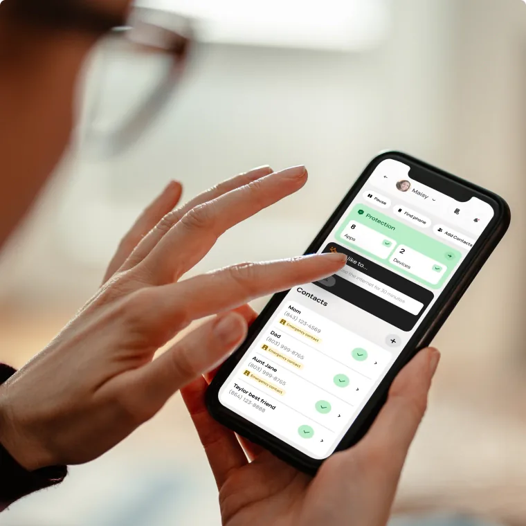 Hand holding a phone showing the Bark app
