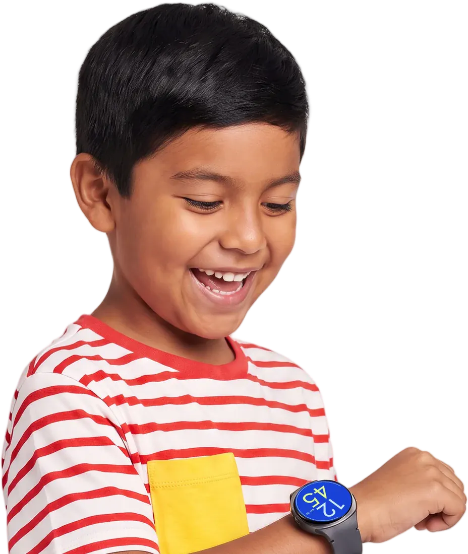 A smiling boy in a red-and-white striped tee checking his Bark Watch