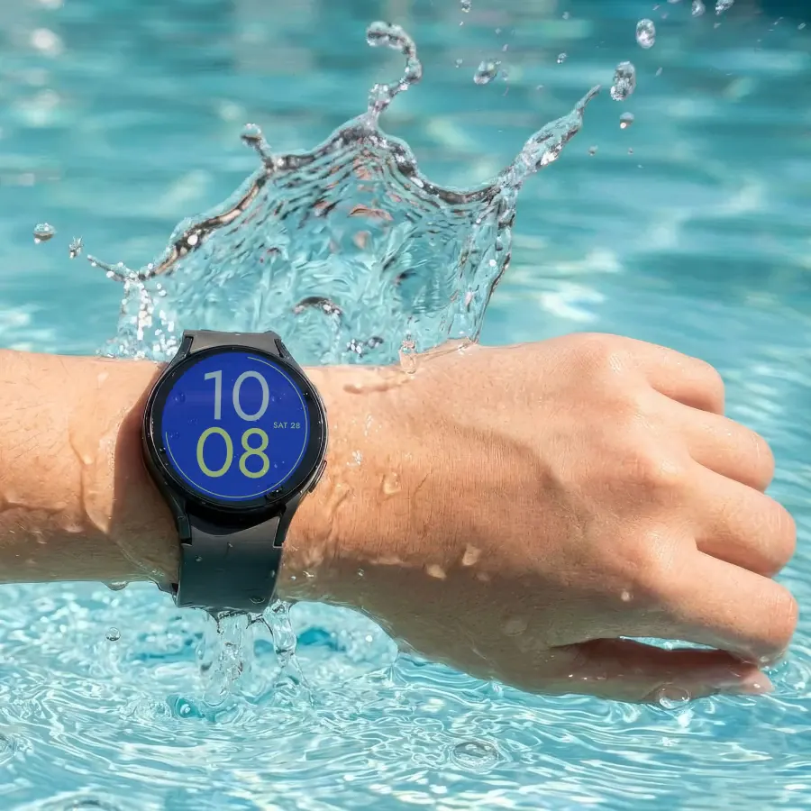 The Bark Watch on a wrist, splashing out of a pool