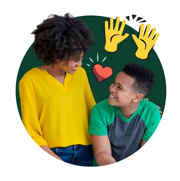 Mom and son smiling with hands raised
